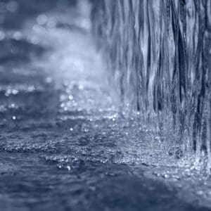 A close up of water flowing on top of the ground